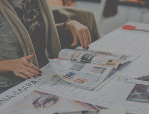 Person reading magazines