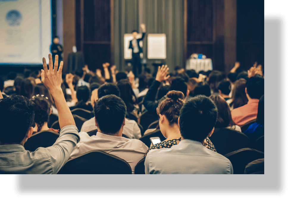 Speaker delivering a seminar to a crowd.